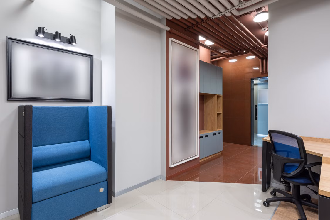 Representative image: contemporary office fitout with workspace and acoustic booth