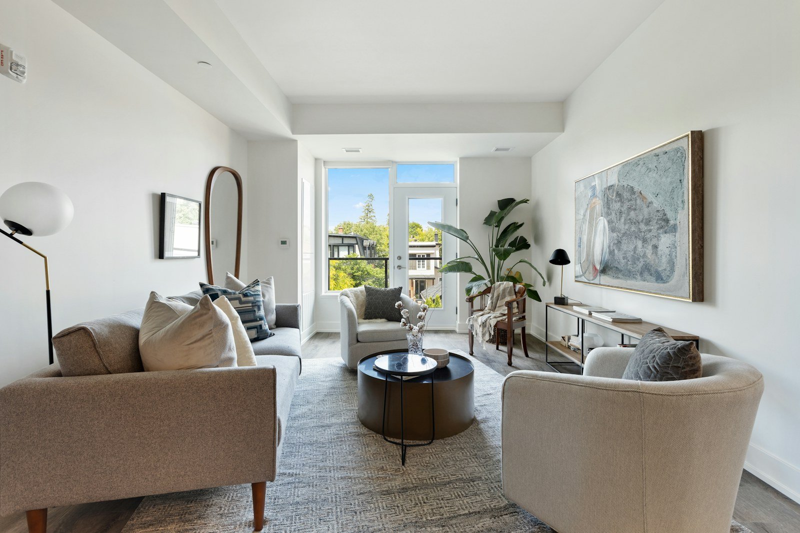 Representative image: living room with white sofa and green potted plant