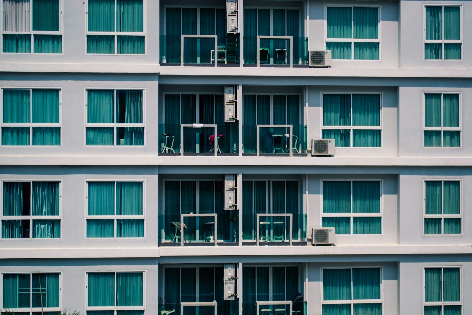 Representative image: Modern apartment building exterior with numerous windows and balconies