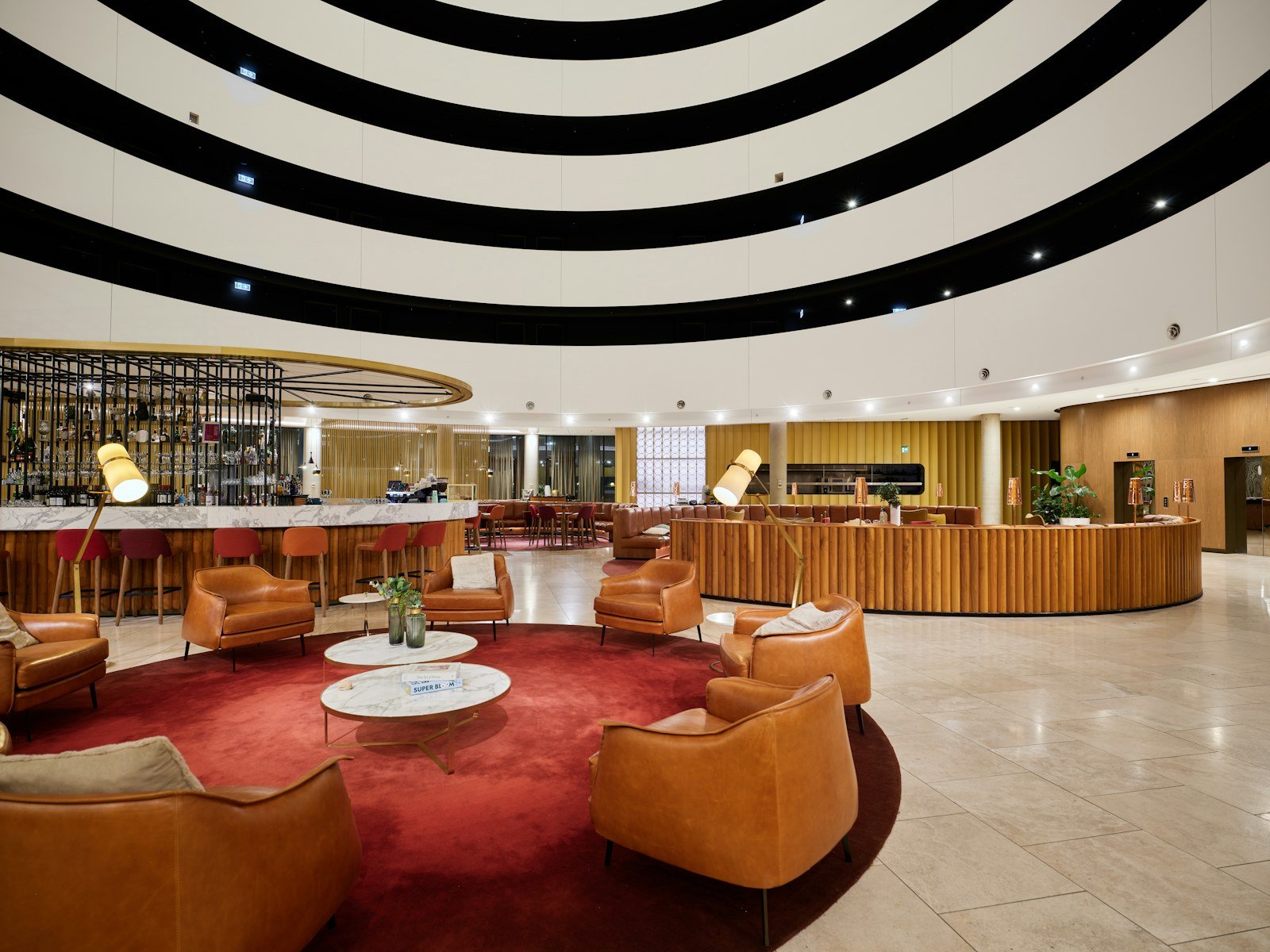 Representative image: Modern hotel lobby with circular seating and bar area