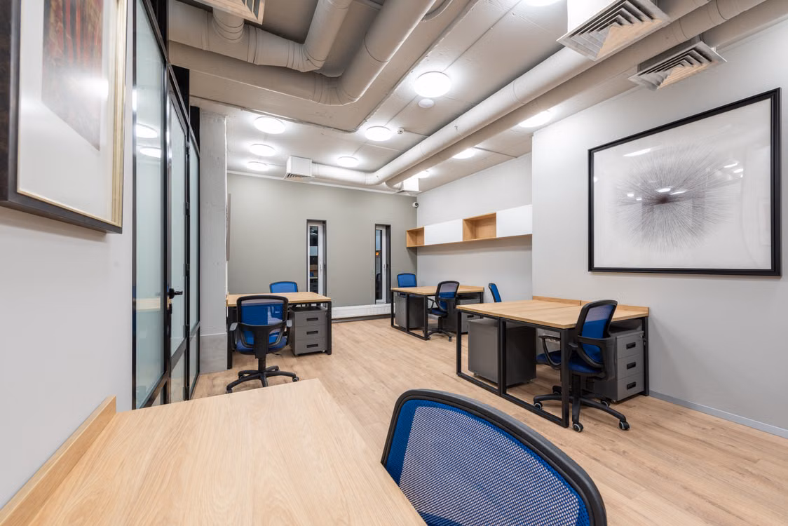 Representative image: Contemporary office interior with desks, chairs, and abstract art. Ideal for business settings