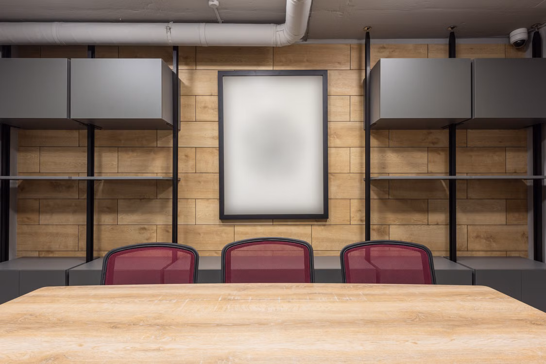Representative image: Contemporary interior of new boardroom equipped with wooden table and red office chairs