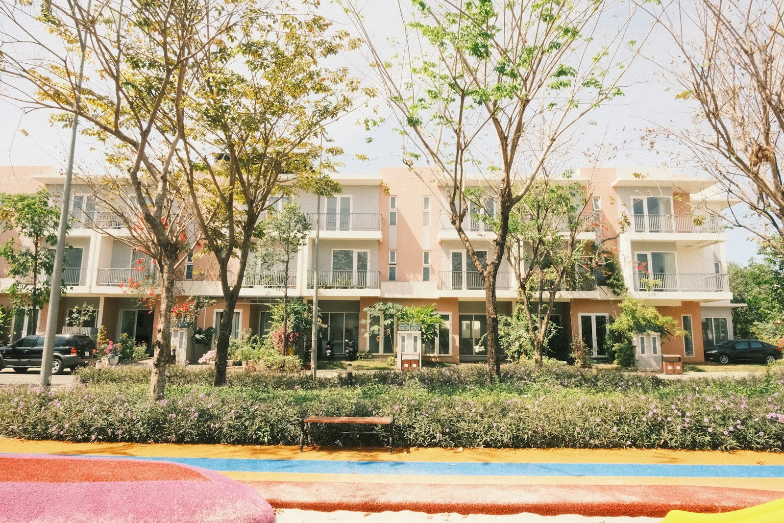 Representative image: Modern townhouses with trees and colorful foreground