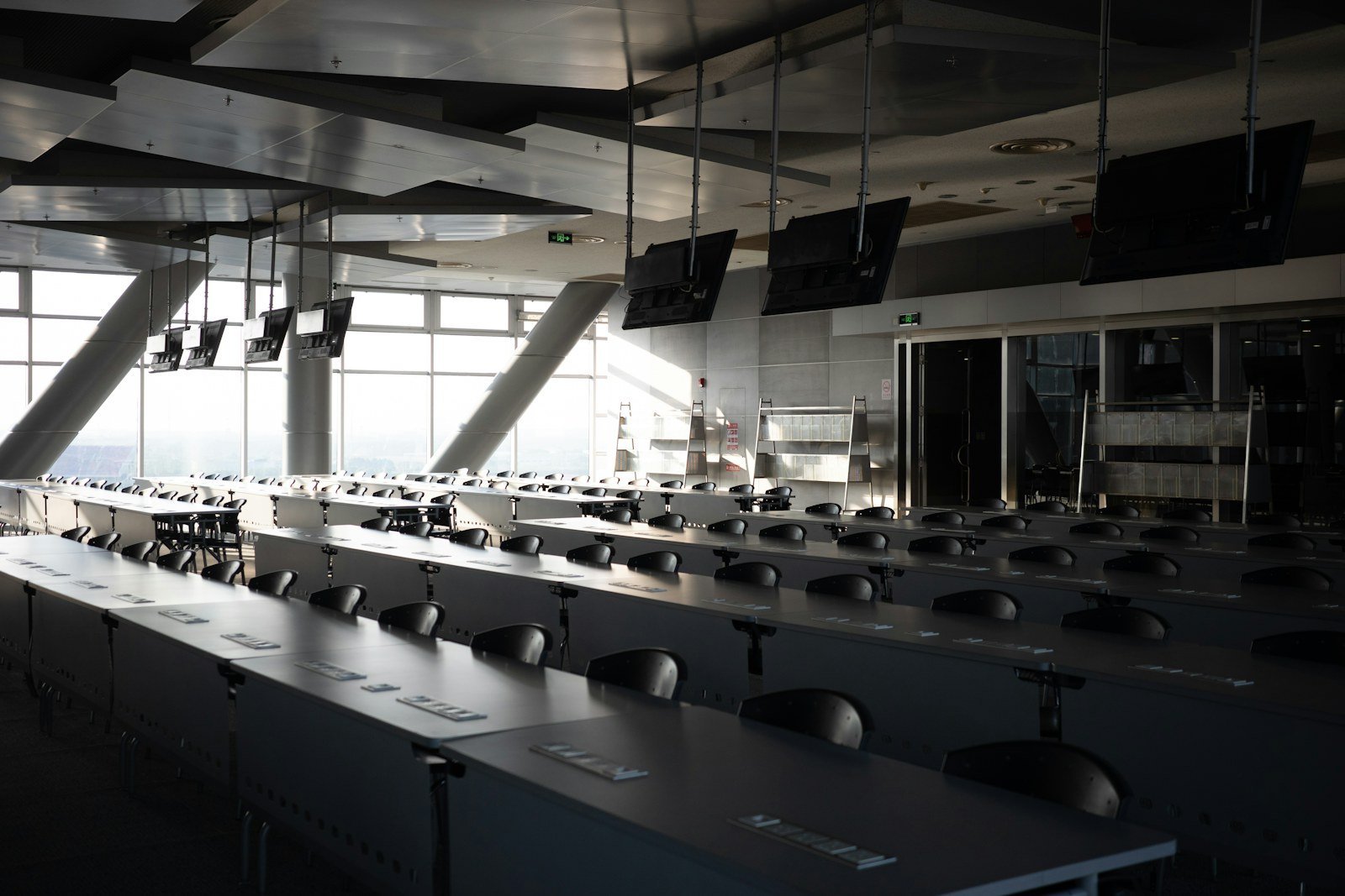 Representative learning-space interior with desks and large windows